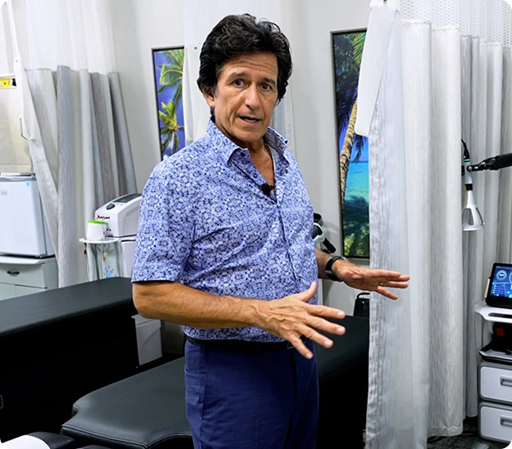 Dr. Ivan presenting treatment rooms at Novar&eacute; Injury Care