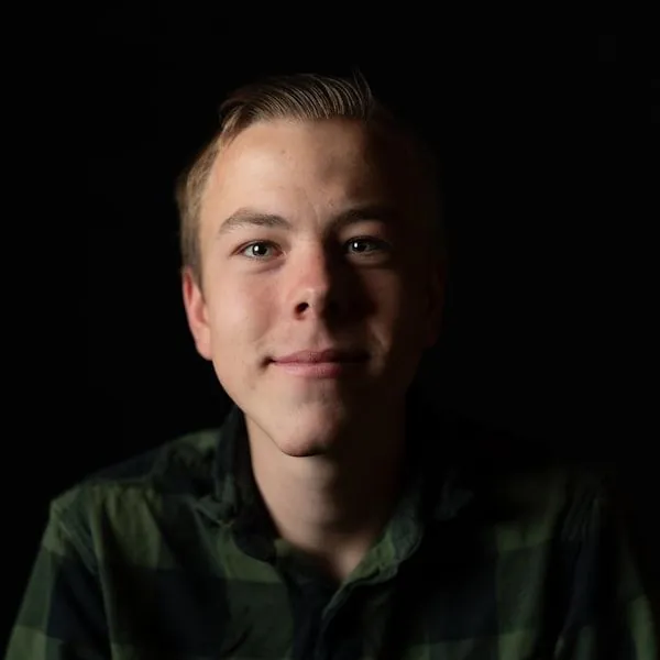 Male healthcare professional from Fort Myers Novare Injury Care team in dark shirt portrait.