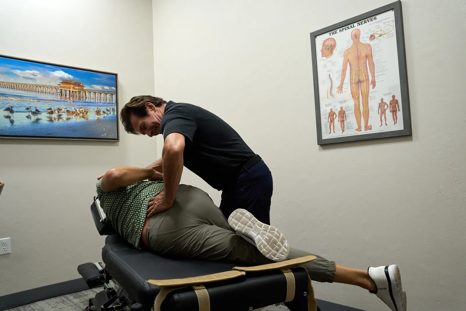 Dr. Ivan reviewing a treatment plan at Novar&eacute; Injury Care