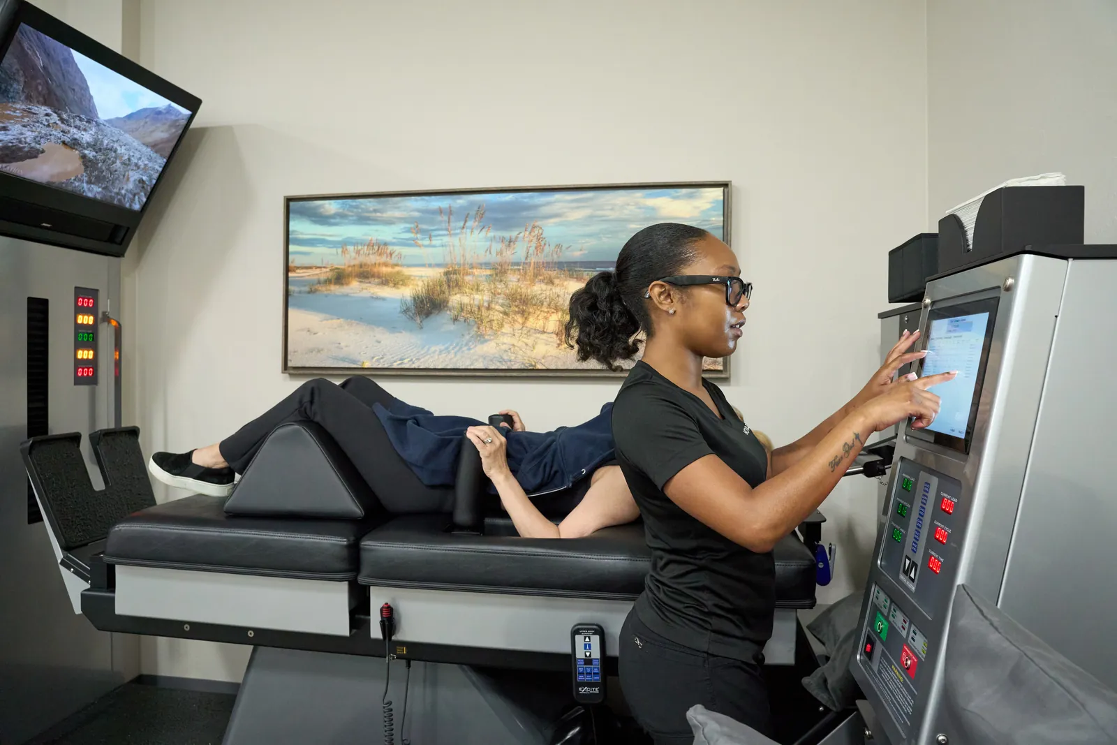 Dr. Ivan presenting treatment rooms at Novar&eacute; Injury Care