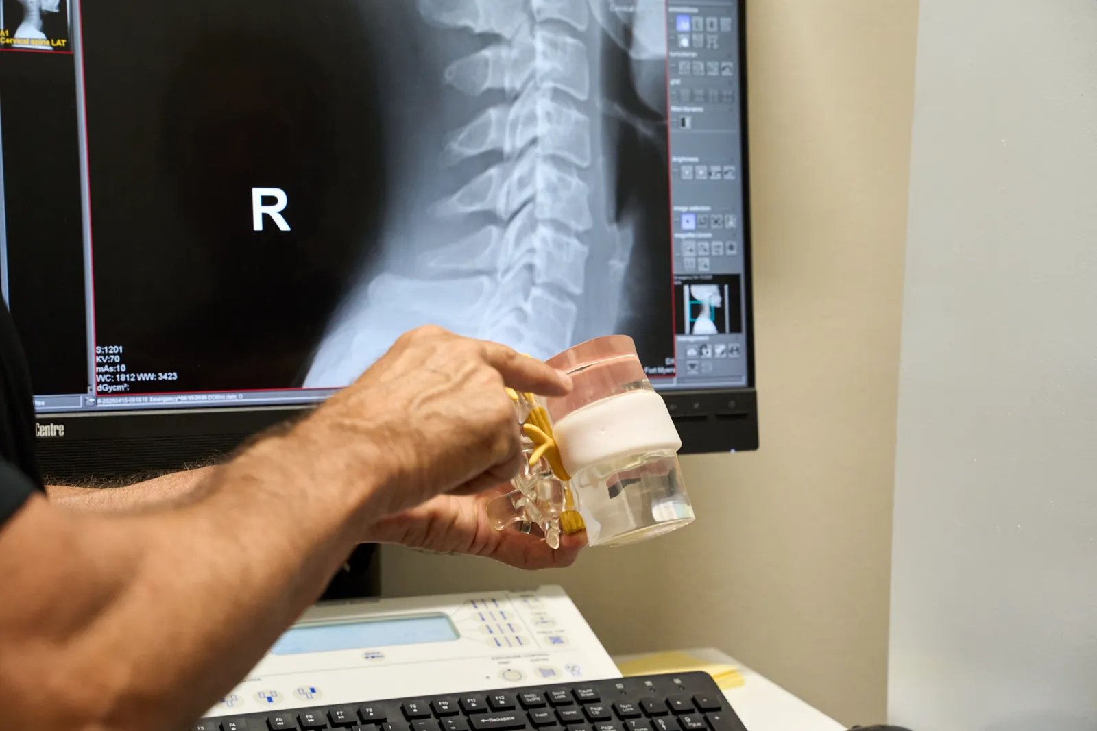 Dr. Ivan presenting treatment rooms at Novar&eacute; Injury Care